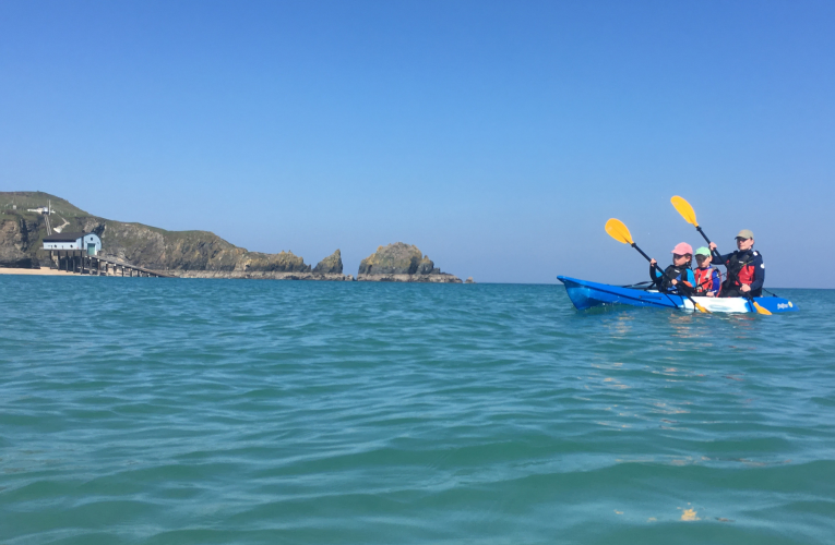 Family kayaking with a Feelfree Gemini Sport sit on top