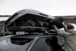 Thule GoPack Duffel bags in a roof box